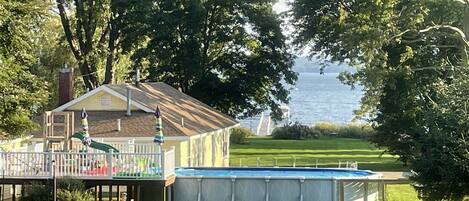 view of back of cottage, heated Pool , Lake View