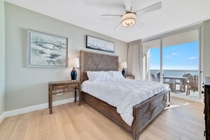 Primary bedroom with balcony access