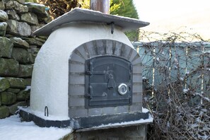 South View, Near Reeth: Wood fired pizza oven on the patio in the enclosed garden