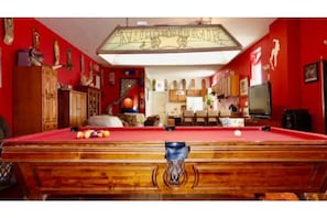Great room with pool table and kitchen.