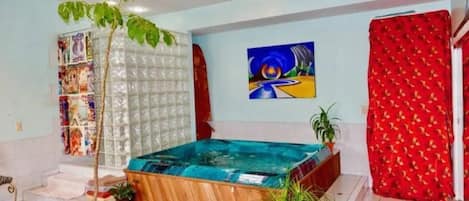 Spa room with hot tub and double shower.