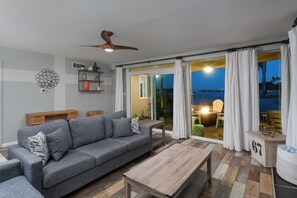 Living area with ample seating and direct patio access.