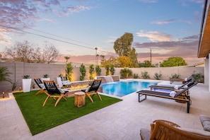 Gather around the fire pit or lounge by the pool.