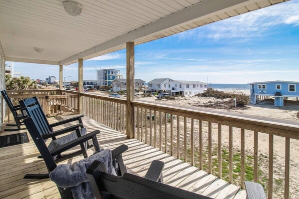 From the deck of the Little Sunshine Cottage you can see the waves tumble in & onto the sandy shore.