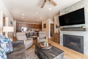 Relax by the stacked stone fireplace.