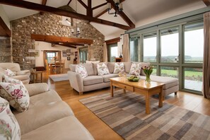East Lodge, Yorkshire - double height ceilings, feature beams and stone detailing throughout the living areas