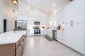 Our kitchen features an oversized island with plenty of room to cook and entertain