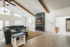 Living Room overseeing the kitchen and dining area with amazing lake views