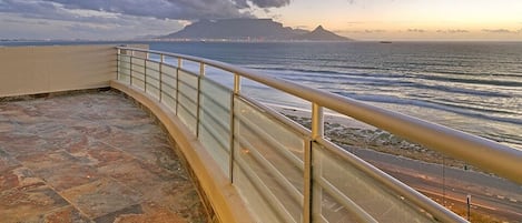 Beach penthouse-style living with professional cleaners, hotel supplied linen and the best views from the 9th floor of Table Mountain and all the kite surfers in the water!