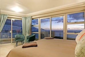 Master bedroom (King Bed Extra length) has views from two sides! Table Mountain and the west facing ocean views! The block out curtains mean you can sleep late if you wish. On suite bathroom with bath and shower