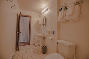 Spacious bathroom with storage space.