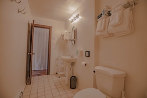 Spacious bathroom with storage space.