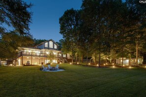 Backyard offers peaceful relaxation, especially by the outdoor fire pit