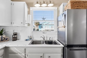 Quaint coastal kitchen- lots of natural light!