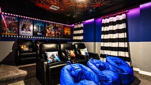 Private home theater with recliners, bean bags, and Disney magic all around.