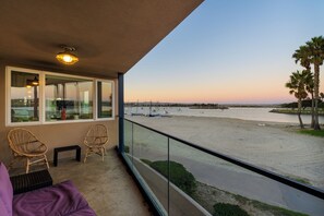 This spacious balcony offers stunning Bayfront views and plenty of comfortable seating.