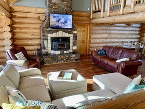 Sunny living room with soaring ceilings and plenty of room to entertain. 