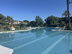 Communal pool, shallow end suitable for young children, plenty of sun loungers