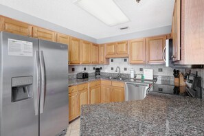 The fully equipped kitchen has everything you need to whip up delicious meals during your stay.