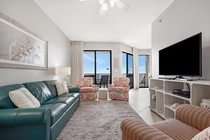 The warm living area offers ample room to relax and entertain. With comfortable seating, stylish decor, and plenty of natural light, it's the perfect place to gather with loved ones and make lasting memories.