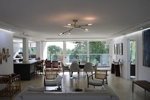 Spacious living and dining area with view of large city park