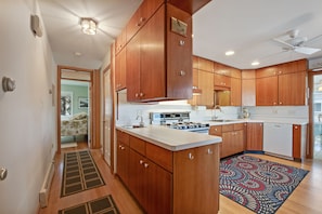 hall leads to the master bedroom. Half bath would be on your left