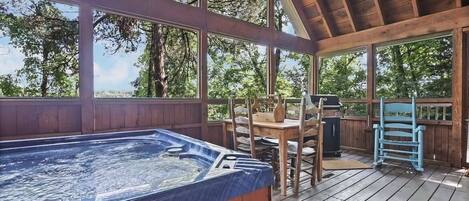 Relax and unwind in the large hot tub after grilling out!