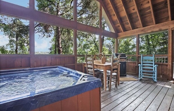 Relax and unwind in the large hot tub after grilling out!