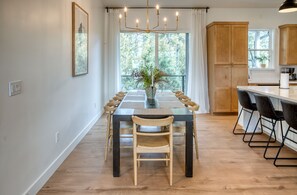 Dining area accommodates eight and the bar top fits three. 