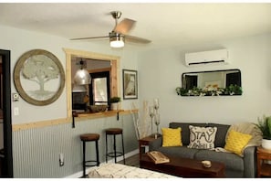 The kitchen’s pass-through window into the living room adds to the openness. 