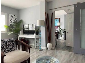Living room looking onto the bedroom.