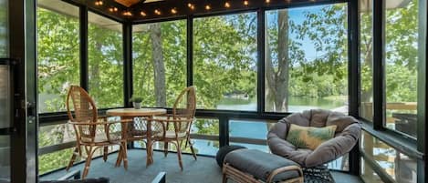 Enjoy your morning coffee or happy-hour in the tree-house-like screened-in-porch