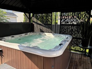 Private hot tub for four people available 24/7.