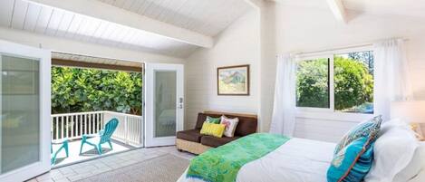 Queen bed overlooking lanai.