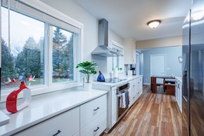 Gorgeous kitchen includes plenty of counter space and is fully stocked!