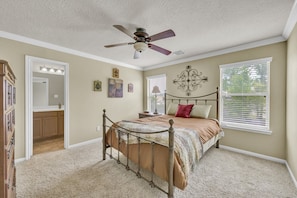 Primary bedroom with a queen bed and private bathroom