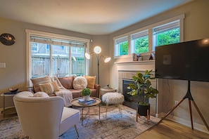 The main living area features a gas fireplace, creating a cozy and inviting space for relaxation and entertaining.