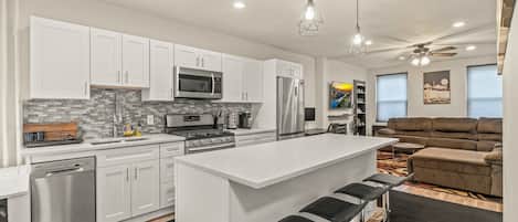 Stainless steel appliances, marble counters, huge island bar!