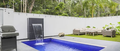 Vibrant pool and lounging in the backyard for extra luxury!