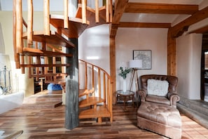 A spiral staircase in a living room.