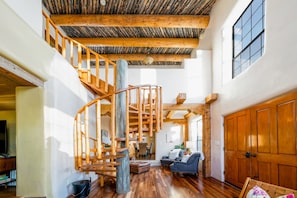 A spiral staircase in a living room.