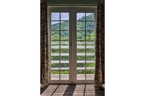 French doors and view from Captain’s Cove bedroom. 