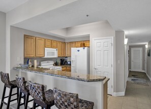 The kitchen has granite countertops and a fully stocked kitchen allowing our guests prepare a beach snack or a full dinner for your guests.