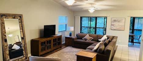 Spacious great room with ceiling fans.