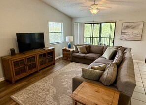 Living room (view from foyer) with 55 inch Roku TV