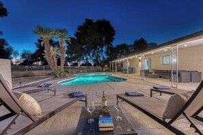 Large private backyard with heated swimming pool