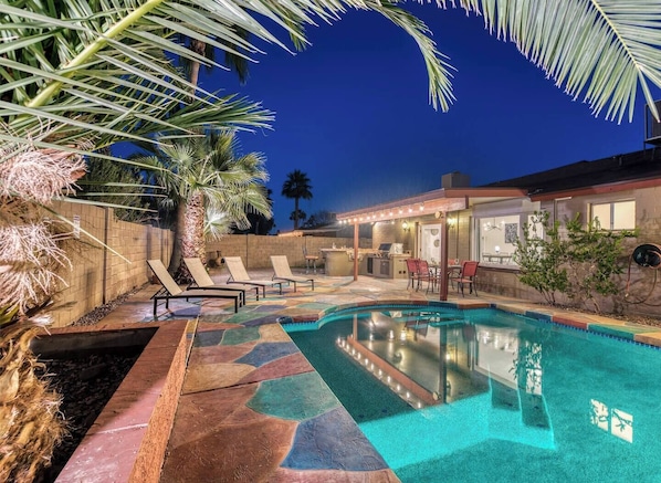 Large private backyard with heated pool.