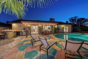 Large private backyard with heated pool.