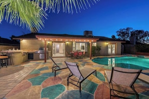 Large private backyard with heated pool.