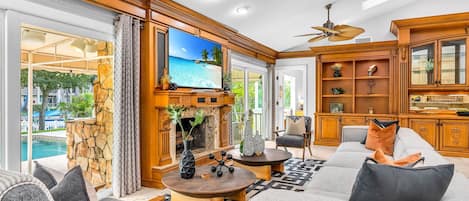 The large open-plan living room lies next to the kitchen and entrance to the pool room. There are gorgeous views of the pool deck and Intracoastal, and direct access to the pool deck from the living room.